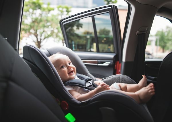 a-photo-of-a-baby-in-a-car-seat looking at an auto body technician at Collision Care bumper repair baby-in-a-car-seat-looking-at-an-auto-body-technician-at-Collision-Care