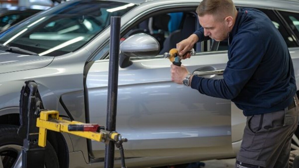 Auto Body Technician doing Hail Damage Repair PDR