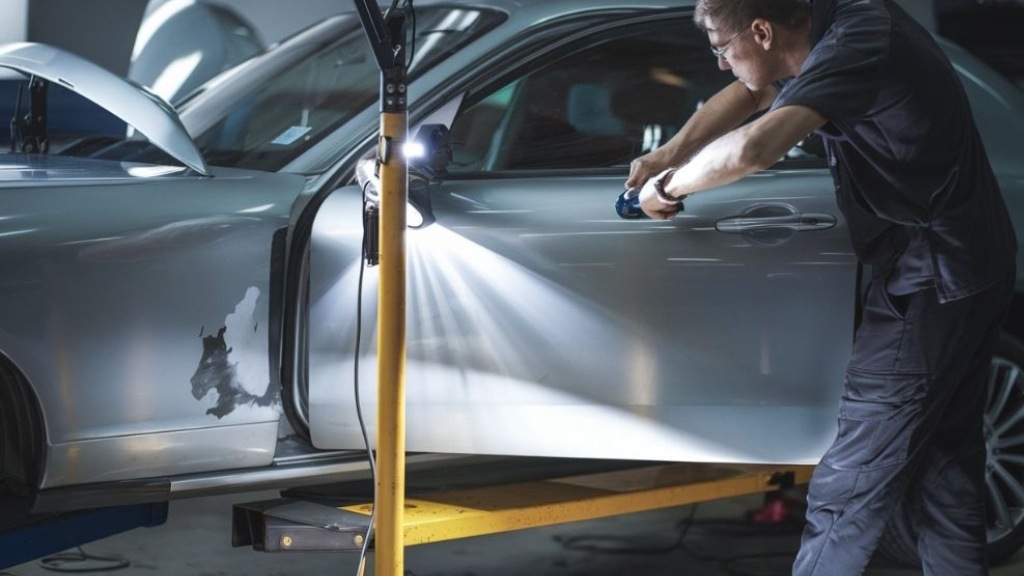 Paintless Dent Repair tech