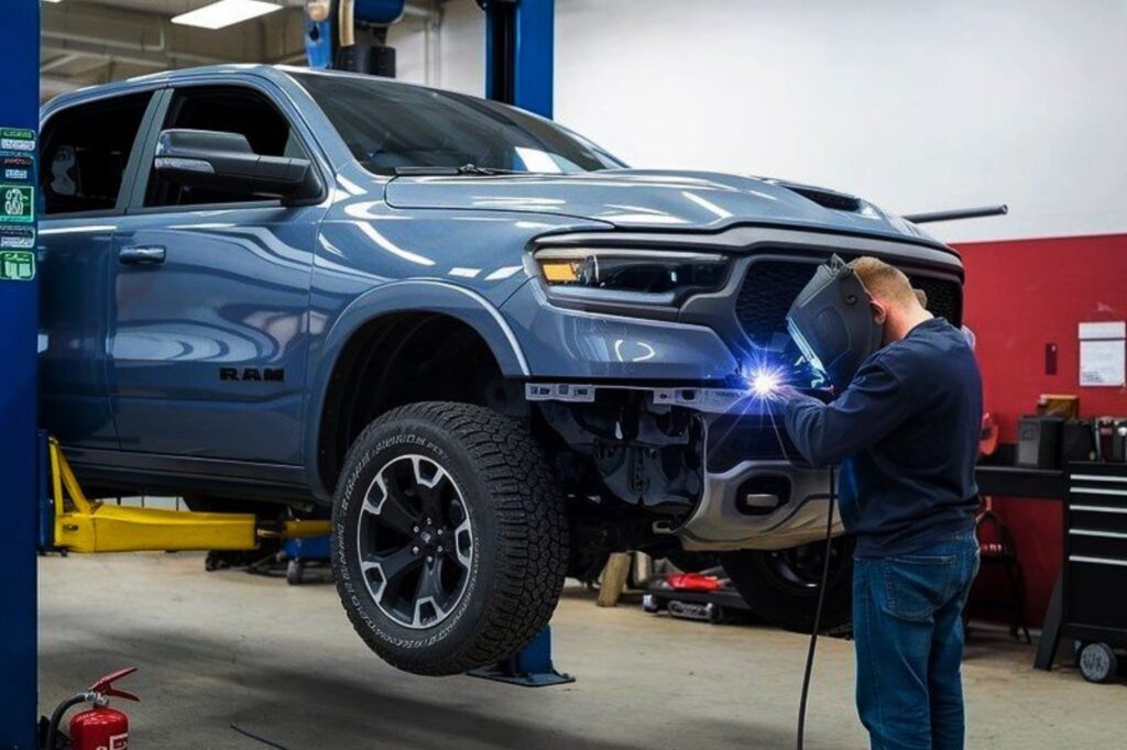 Arlington Certified Collision Repair tech welding on truck